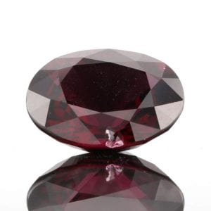 inclusion in red ruby gem with bottom reflection product photography example
